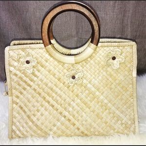 Vintage straw woven purse with wood handles.